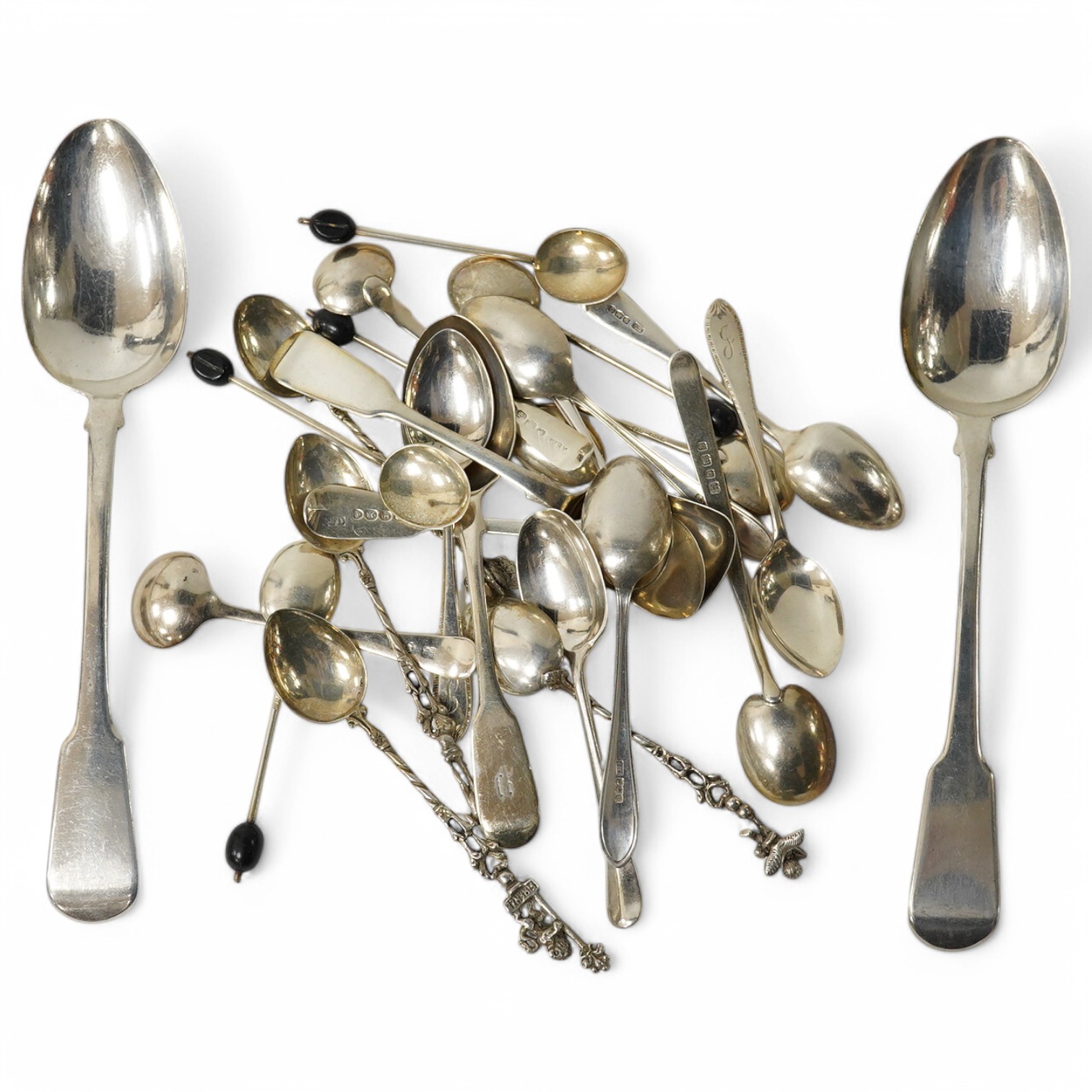 A pair of George IV silver fiddle pattern serving spoons, William Seaman, London, 1820, together with a collection of silver tea, coffee and caddy spoons, gross 10.9oz. Condition - poor to fair